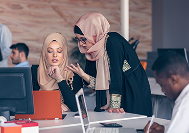 Two women working at computer